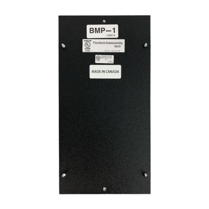 Notifier BMP-1 blank module dress plate for fire alarm systems, shown in a clean, white finish on a wall.