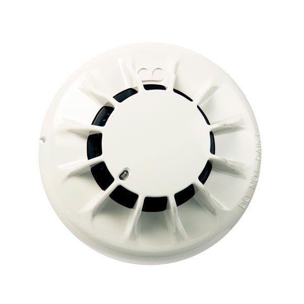 Simplex 4098-5601 fire alarm smoke detector, black device with test button and indicator light, designed for fire safety systems.