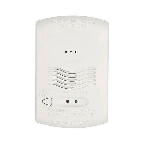 System Sensor CO1224T carbon monoxide detector mounted on wall, fire alarm with digital display and alert indicator.